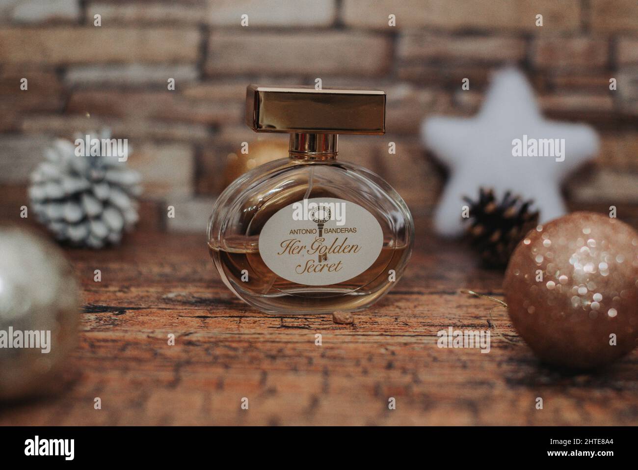 Perfume flacon with winter holiday decorations on the background Stock Photo