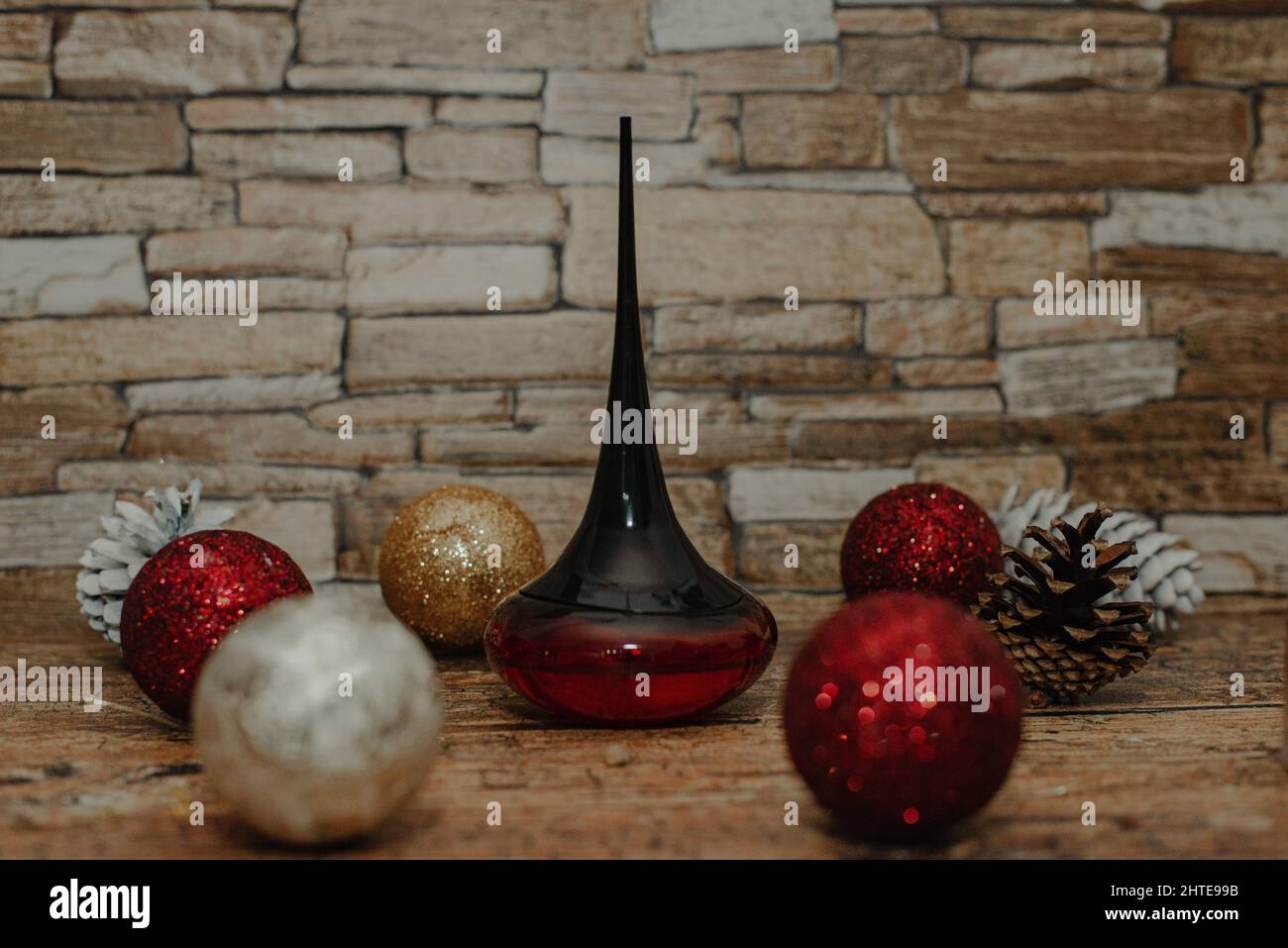 Perfume flacon with winter holiday decorations on the background Stock Photo