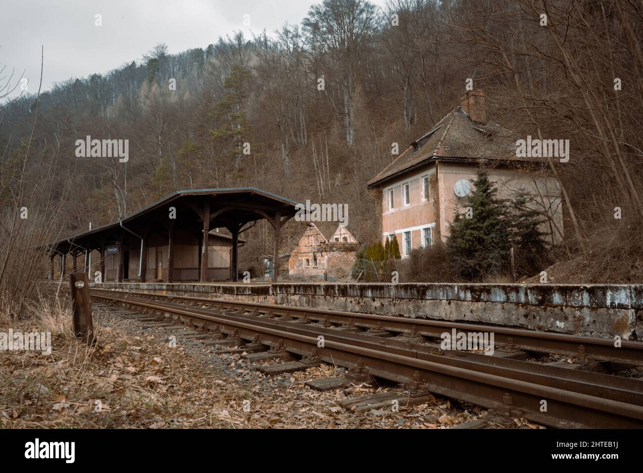 Beautiful shot of a railroad with houses on one side of it Stock Photo ...