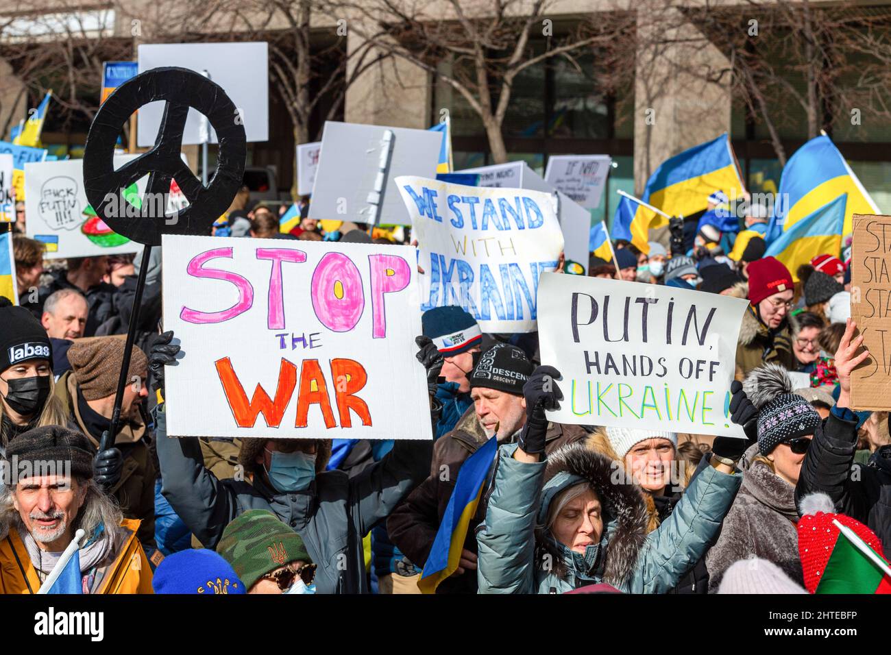 Toronto Ukraine Rally Toronto, Canada - February 27, 2022: A crowd of people marching in Bay ...