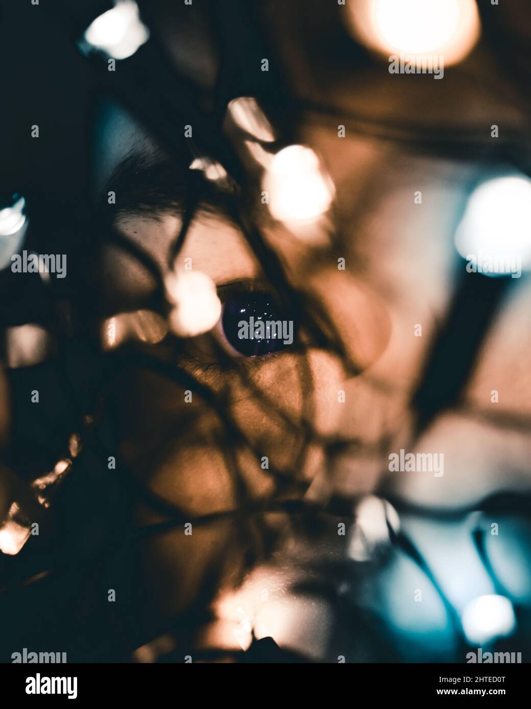 Dark blurred image with burning light bulbs Stock Photo