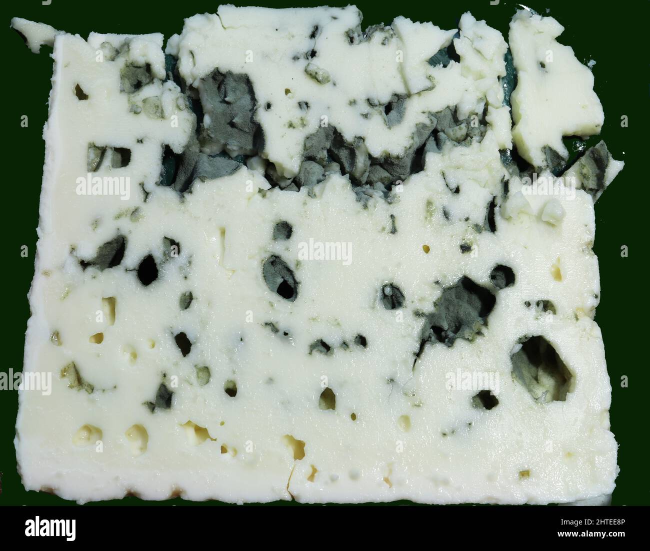 Slice of Roquefort cheese, french sheep milk blue cheese containing