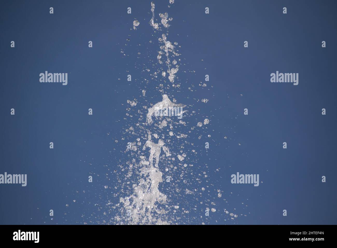 water splash in a blue sky background Stock Photo
