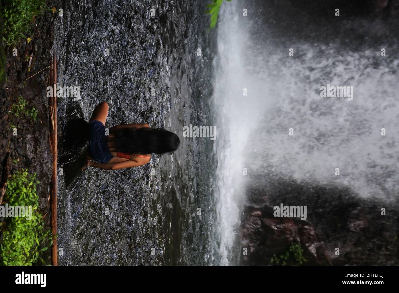 Girl in front waterfall hi-res stock photography and images - Alamy