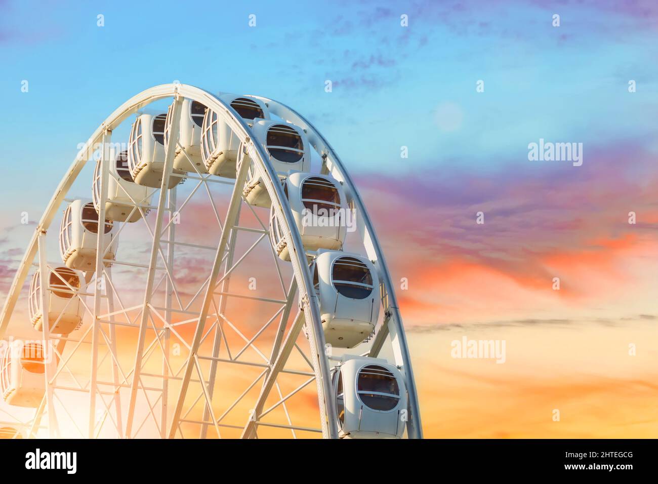 Ferris Wheel on a sunset sky clouds backdrop Stock Photo - Alamy