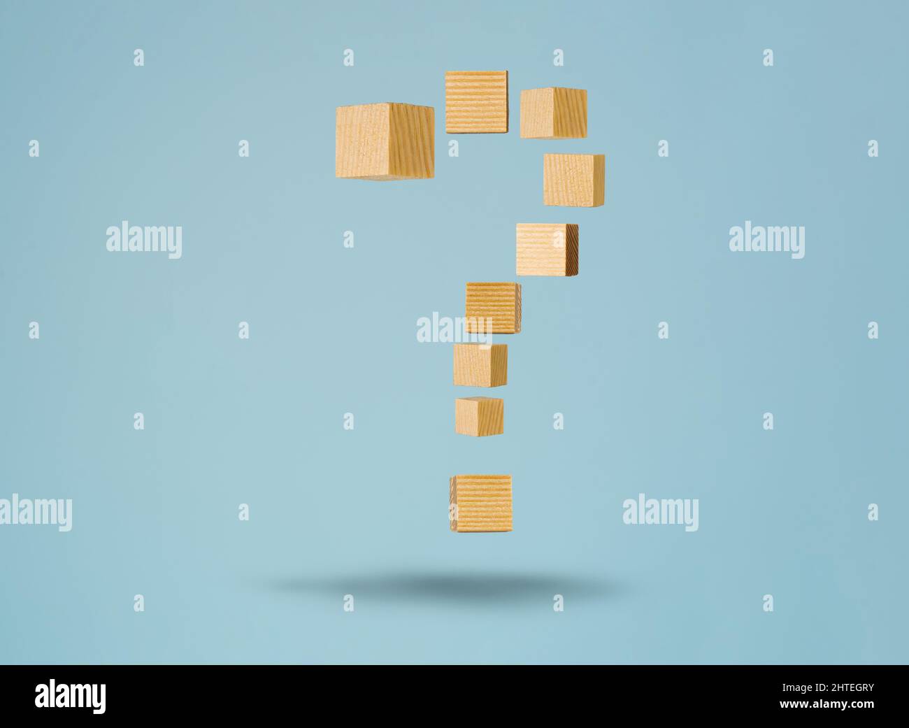 Floating question sign made of wooden blocks. Concept of FAQ and solving problem by providing information and answer. Stock Photo