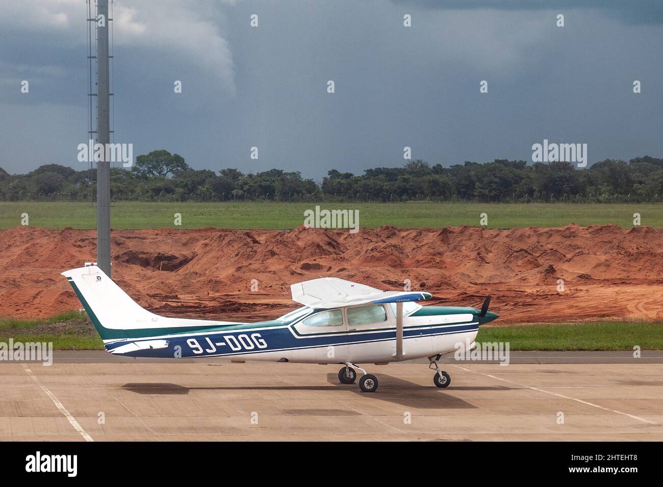 A 1978 Cessna 182 Skylane, registration #9J-DOG stationary on the apron at Livinstone International Airport, Zambia Stock Photo