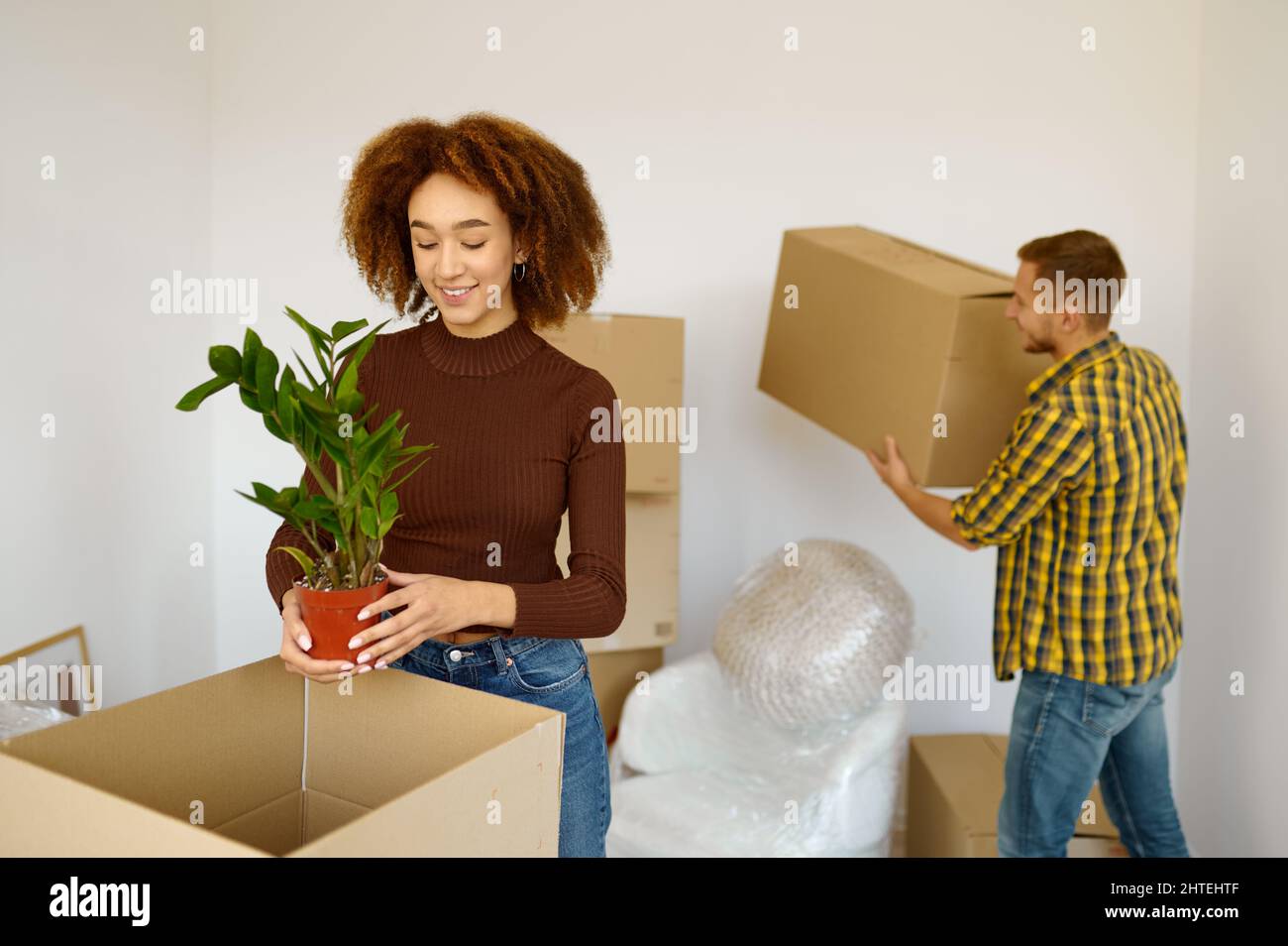 Happy couple packing cardboard box Stock Photo