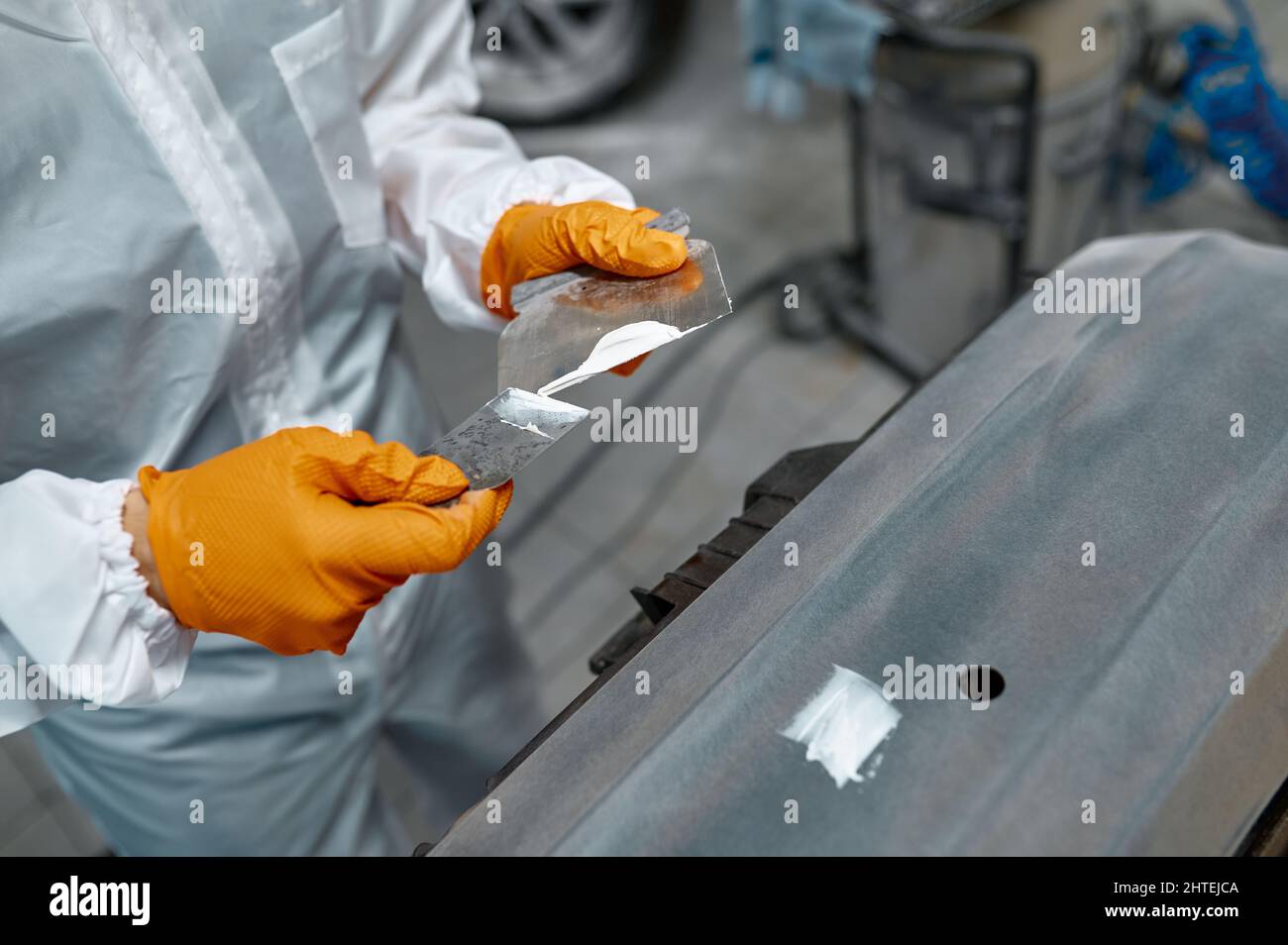 Mechanic engaged in local repairing car body Stock Photo