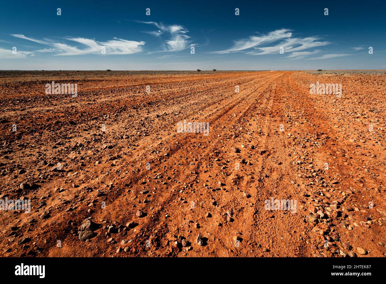 Middle Road is a typical australian gravel road in Sturt National Park Stock Photo