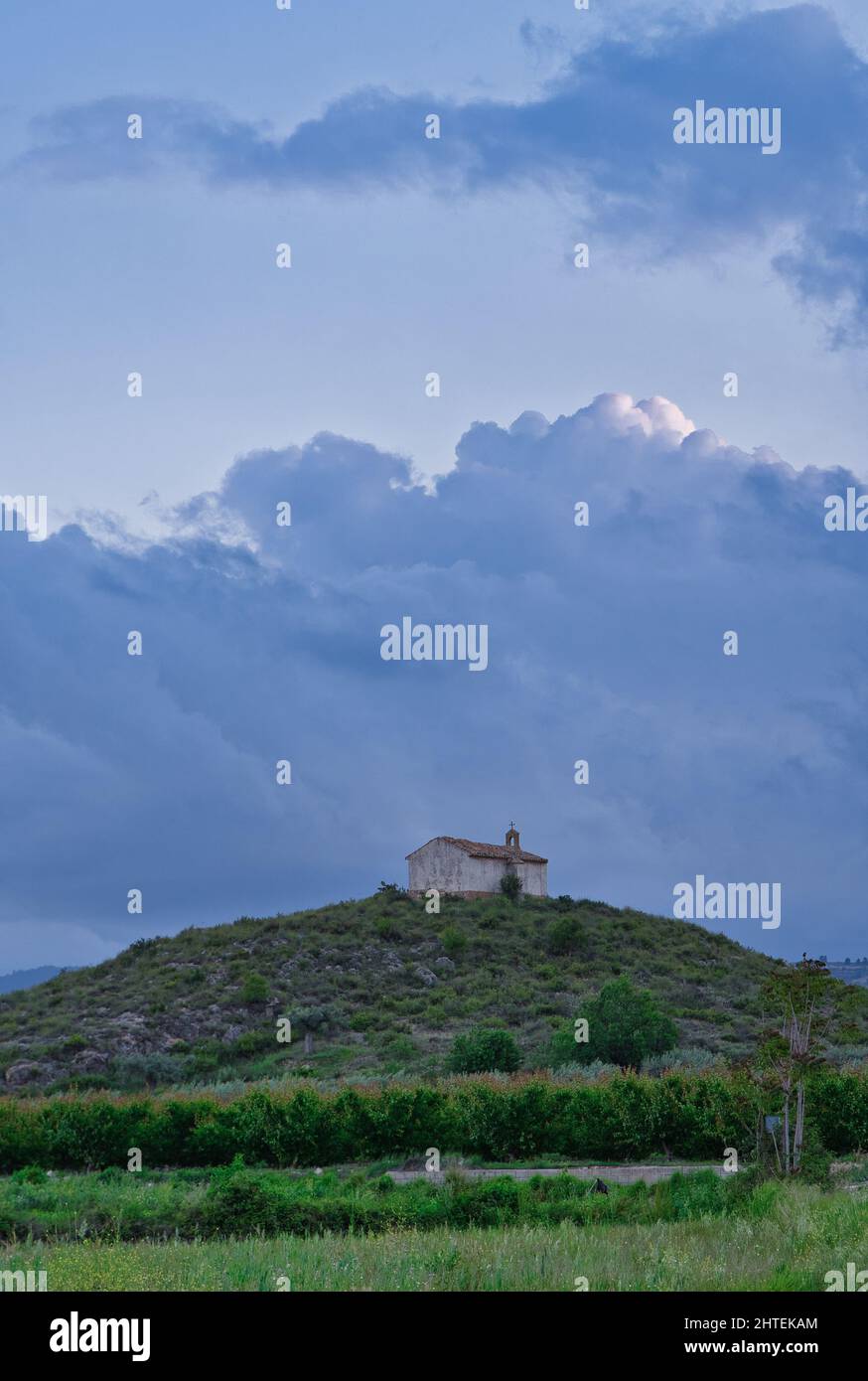 Vertical shot of Our Lady of the Rock Church on the cloudy sky ...