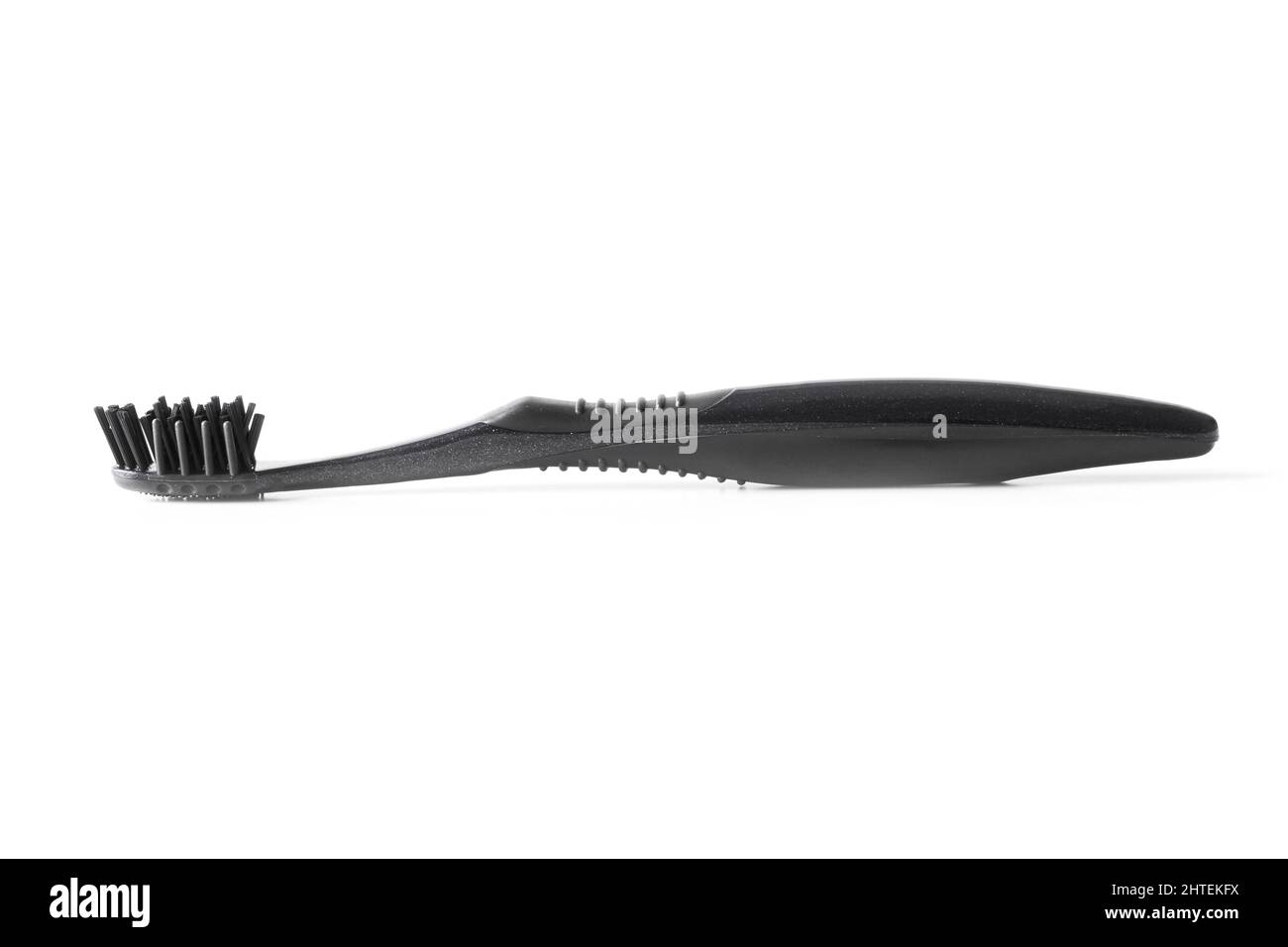 Black plastic toothbrush closeup isolated on white Stock Photo