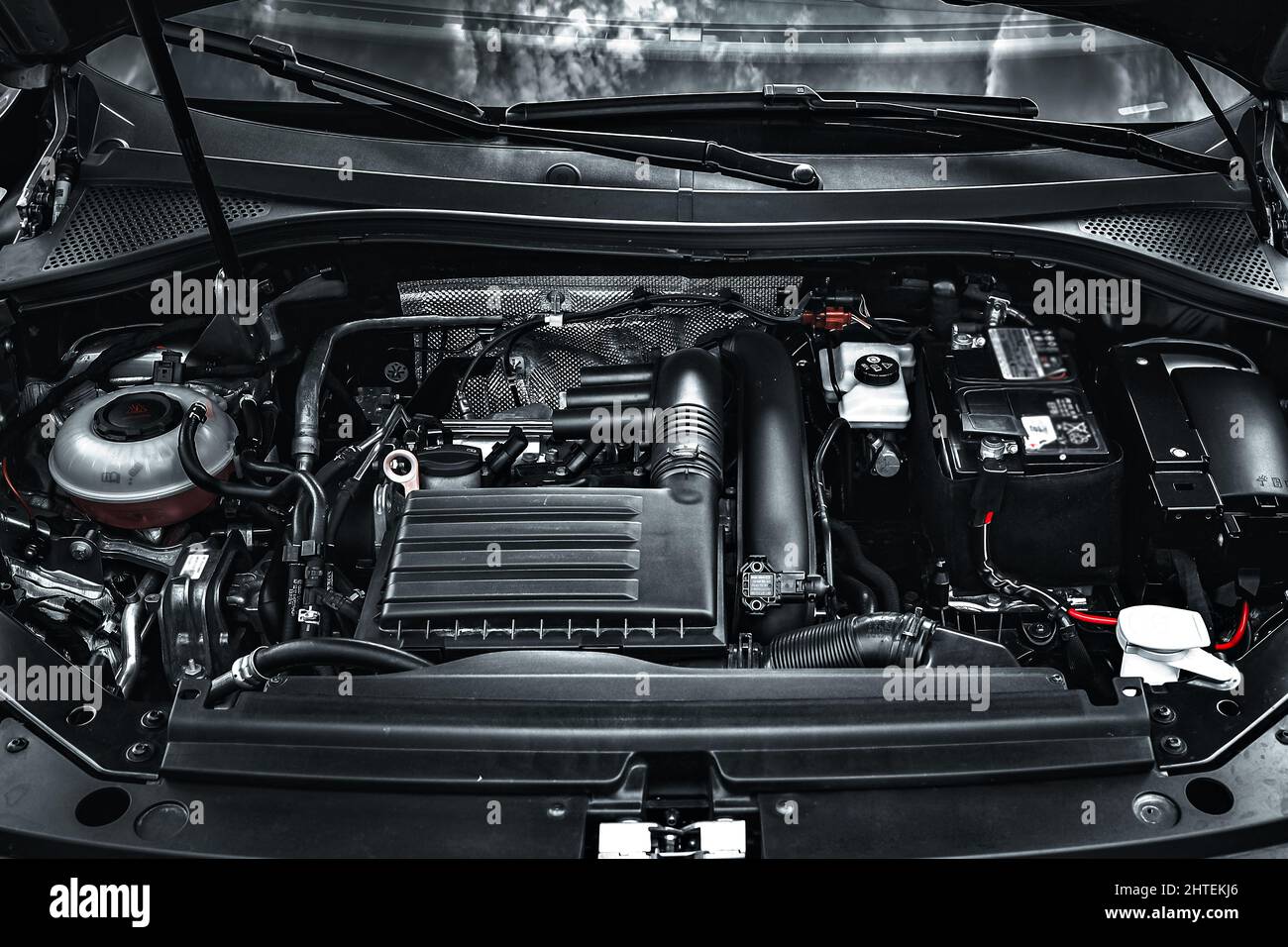 The car engine of a new car. View under the hood. Modern motor close-up. Stock Photo