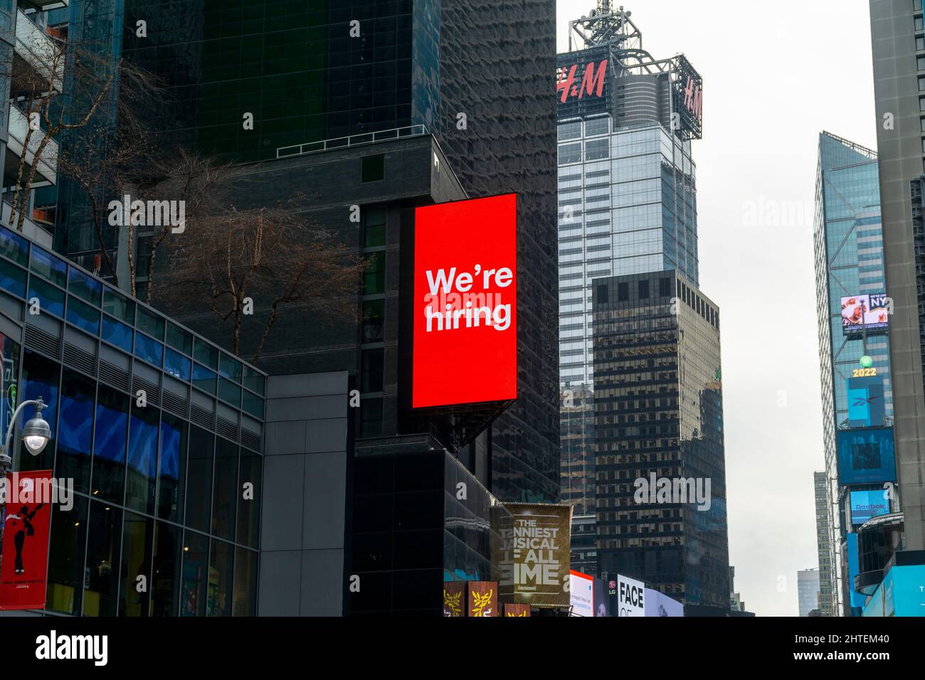 A “We’re Hiring ' sign on a billboard in Times Square in New York on Wednesday, February 16, 2022. (© Richard B. Levine) Stock Photo