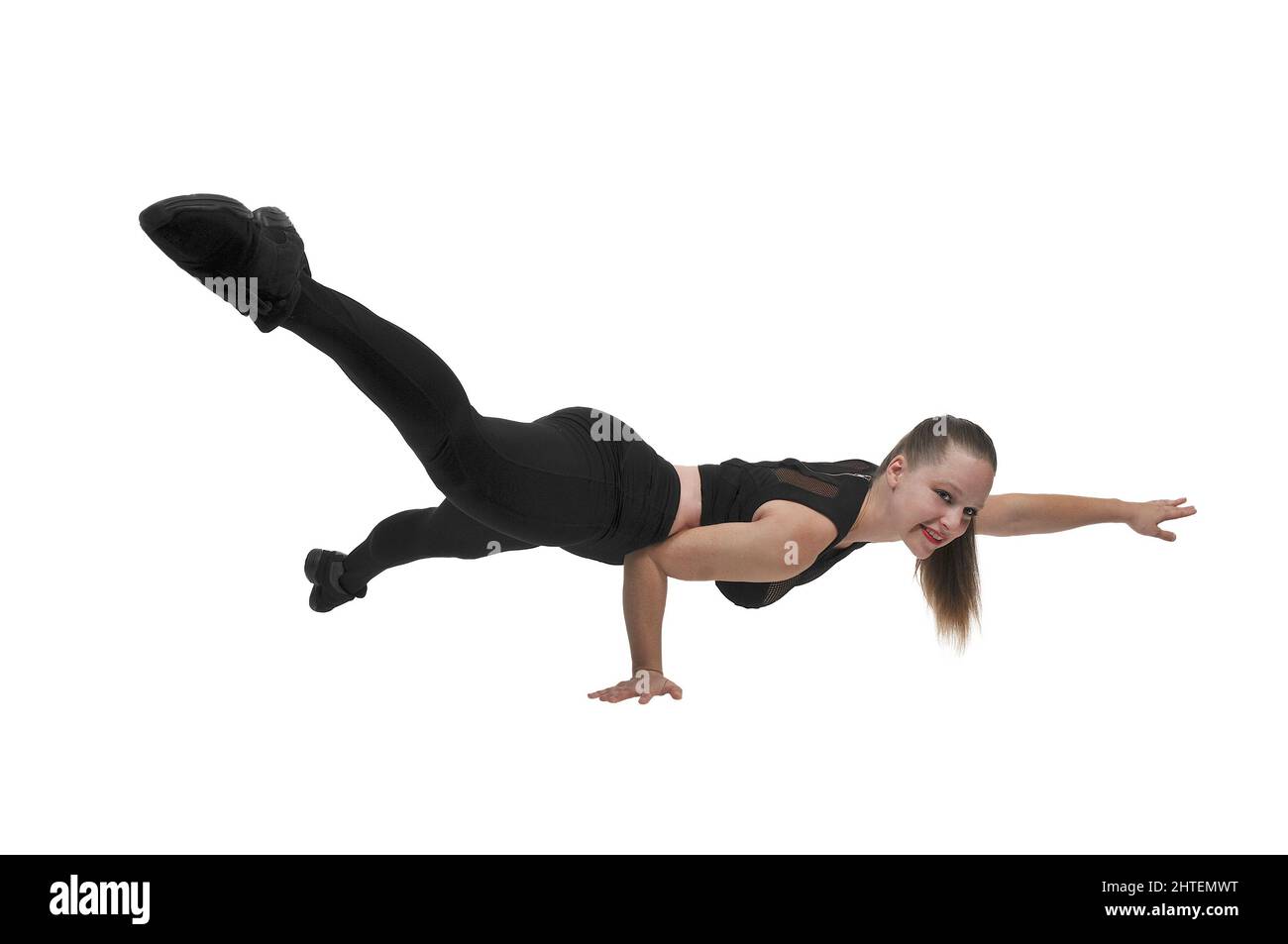 Beautiful woman exercising doing one handed pushups on a white background Stock Photo