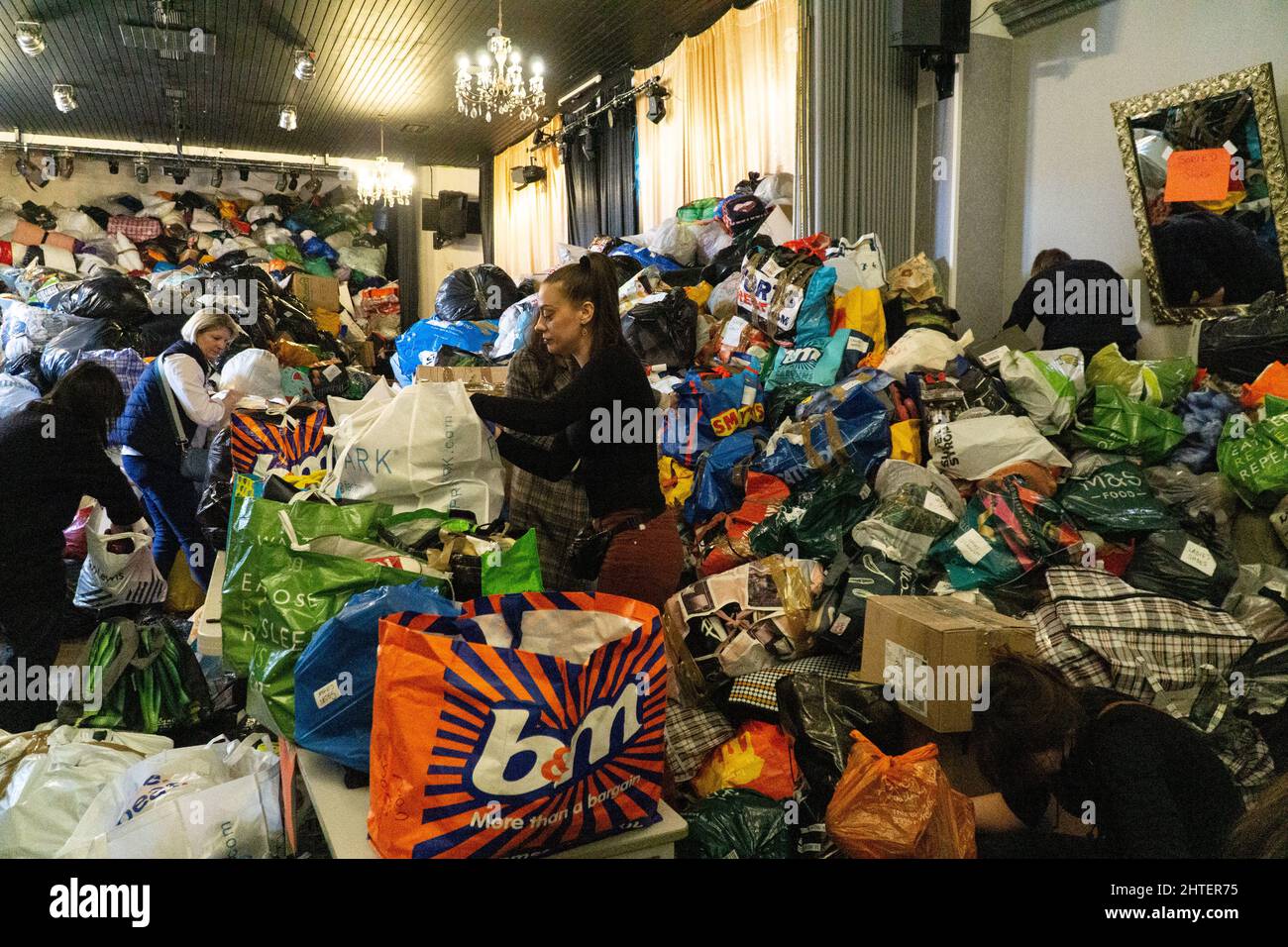 London, UK, 28 February 2021: Aid donations for Ukranian refugees are gathered at the White Eagle Club, a Polish community centre in Balham. Huge quantities have been donated and are being sorted by volunteers and then loaded on to pallets to take on lorries across Europe. Anna Watson/Alamy Live News Stock Photo