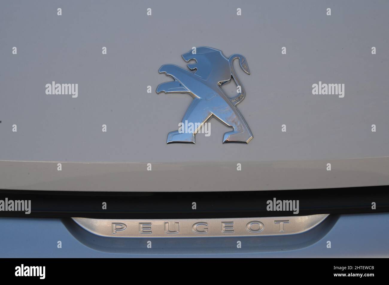 27 February 2022, North Rhine-Westphalia, Cologne: Logo, lettering of the French car manufacturer PEUGEOT brand of Groupe PSA Stellantis on a car Photo: Horst Galuschka/dpa Stock Photo