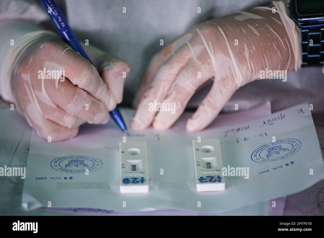 Bangkok, Thailand. 28th Feb, 2022. A healthcare worker seen marking an