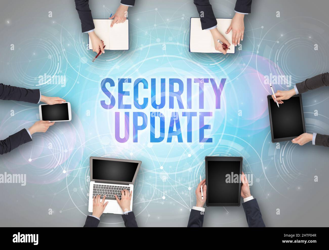 Group of people in front of a laptop, security concept Stock Photo Alamy
