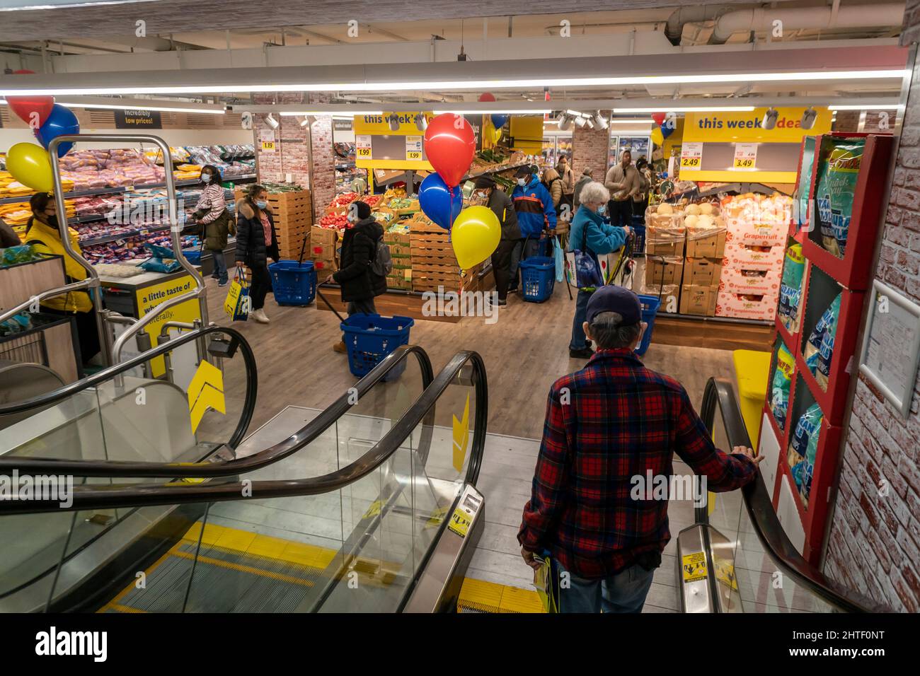 Shoppers attend the grand opening of a Lidl supermarket in Harlem in New York on Wednesday, February 23, 2022. Global unrest in the Ukraine is predicted to take its toll on consumers at they cut back on spending. Americans are encountering the highest inflation rate in 40 years, as consumer spending fell last month, the most since February 2021. (© Richard B. Levine) Stock Photo