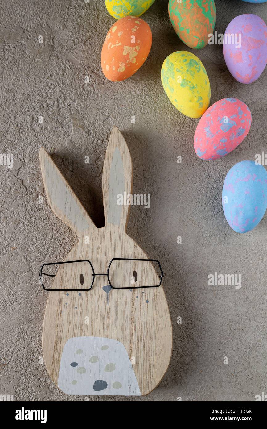 rabbit and colored easter eggs on a gray background Stock Photo