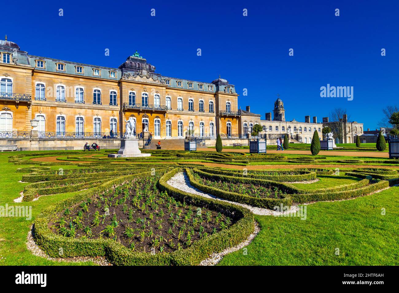 Exterior of early 18th century country mansion Wrest House and topiary of the French Parterre Garden, Wrest Park, Bedfordshire, UK Stock Photo