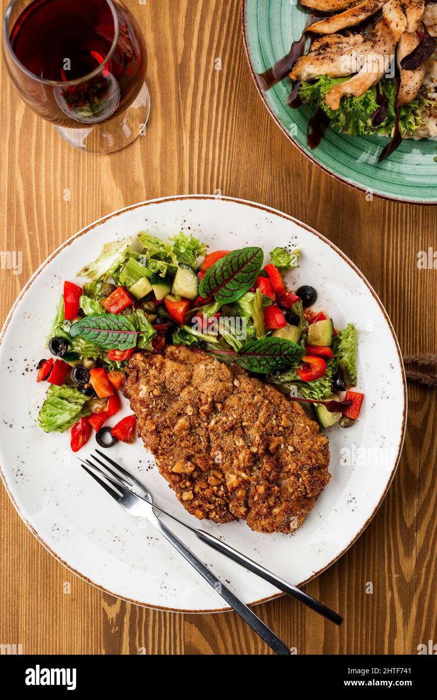grilled pork with a side dish. restaurant menu Stock Photo Alamy