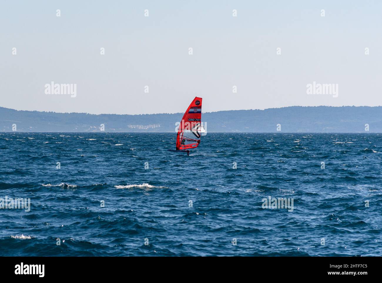 Windsurfing red sail hi-res stock photography and images - Alamy