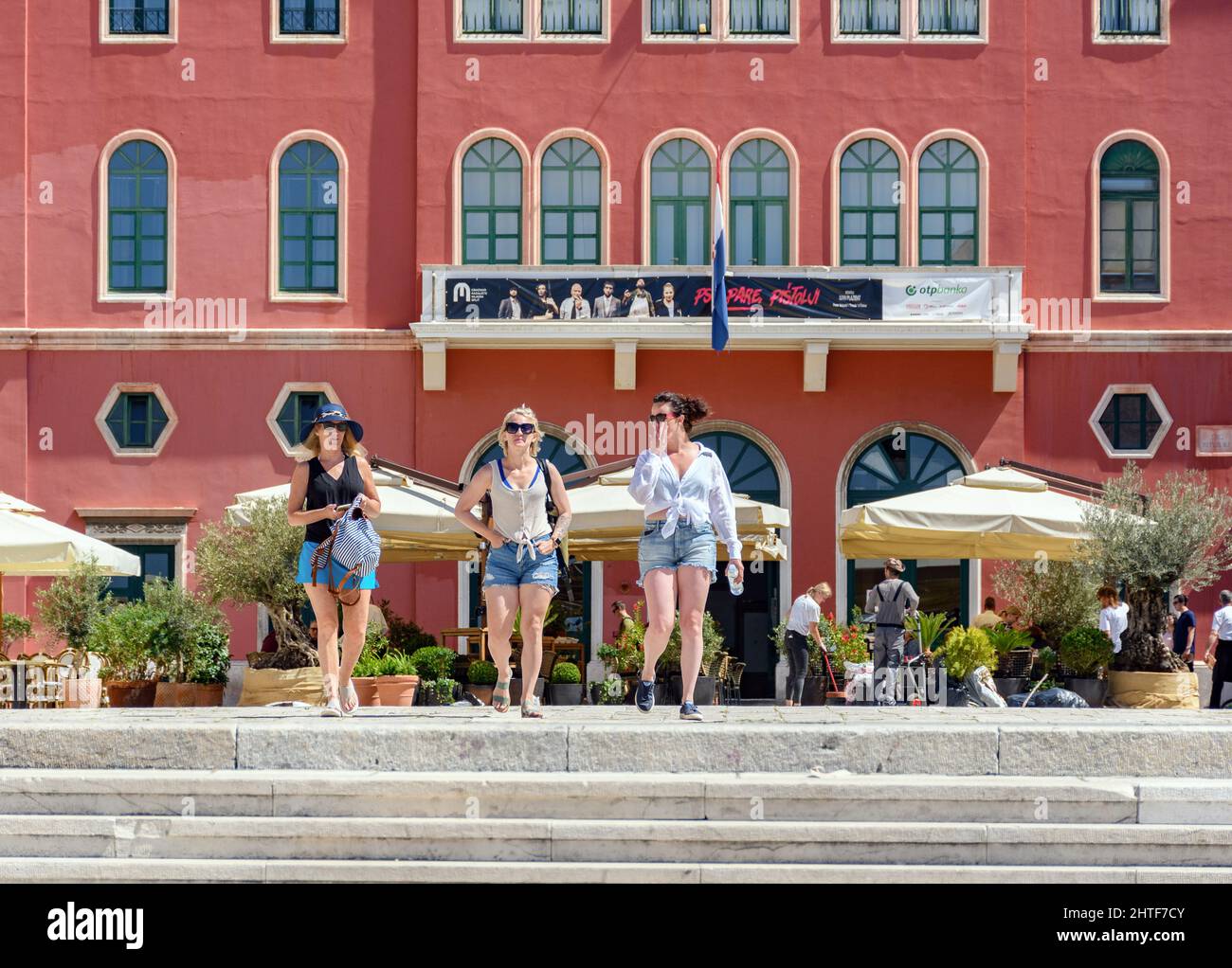 Group of tourists walking through the square in the city of Split in Croatia  Stock Photo - Alamy