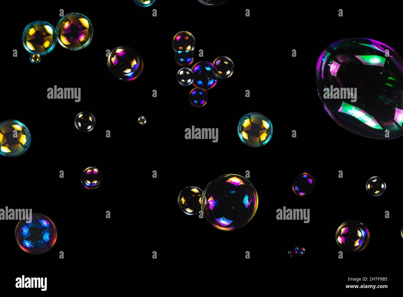 Soap bubbles isolated on a black background. Copy space Stock Photo - Alamy