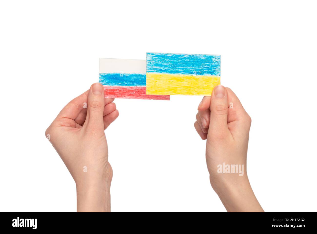 Stop war. Ukraine flag, Russia flag in woman hands isolated on a white background. Stock Photo