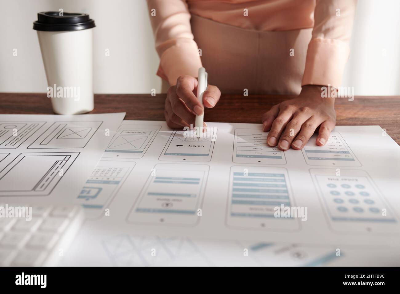 Head of UI and UX design department checking layouts of mobile ...