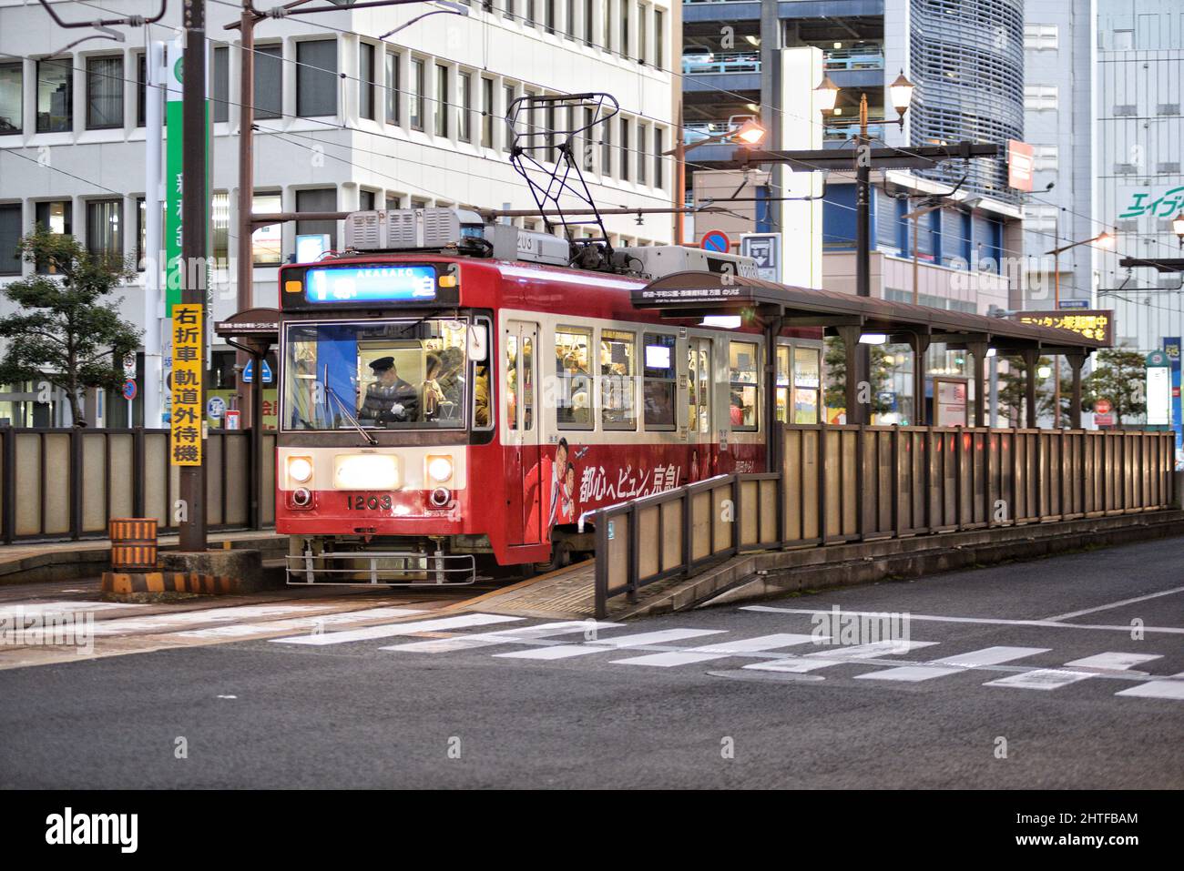 Tramway on the road surrounded by buildings in Nagasaki, Japan Stock ...