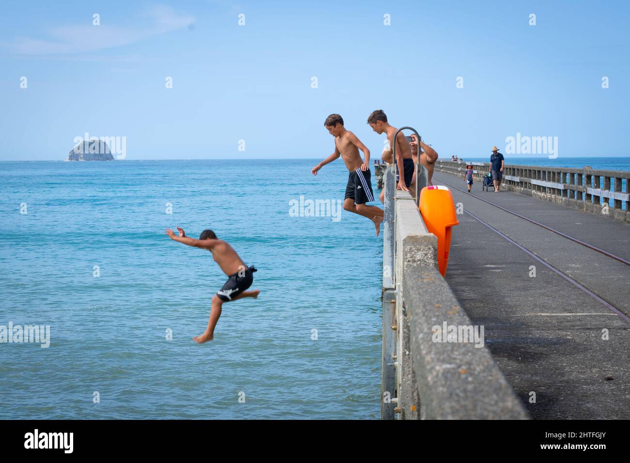 Tolaga Bay New Zealand February 5 2022; Local boys jumping of Tolaga