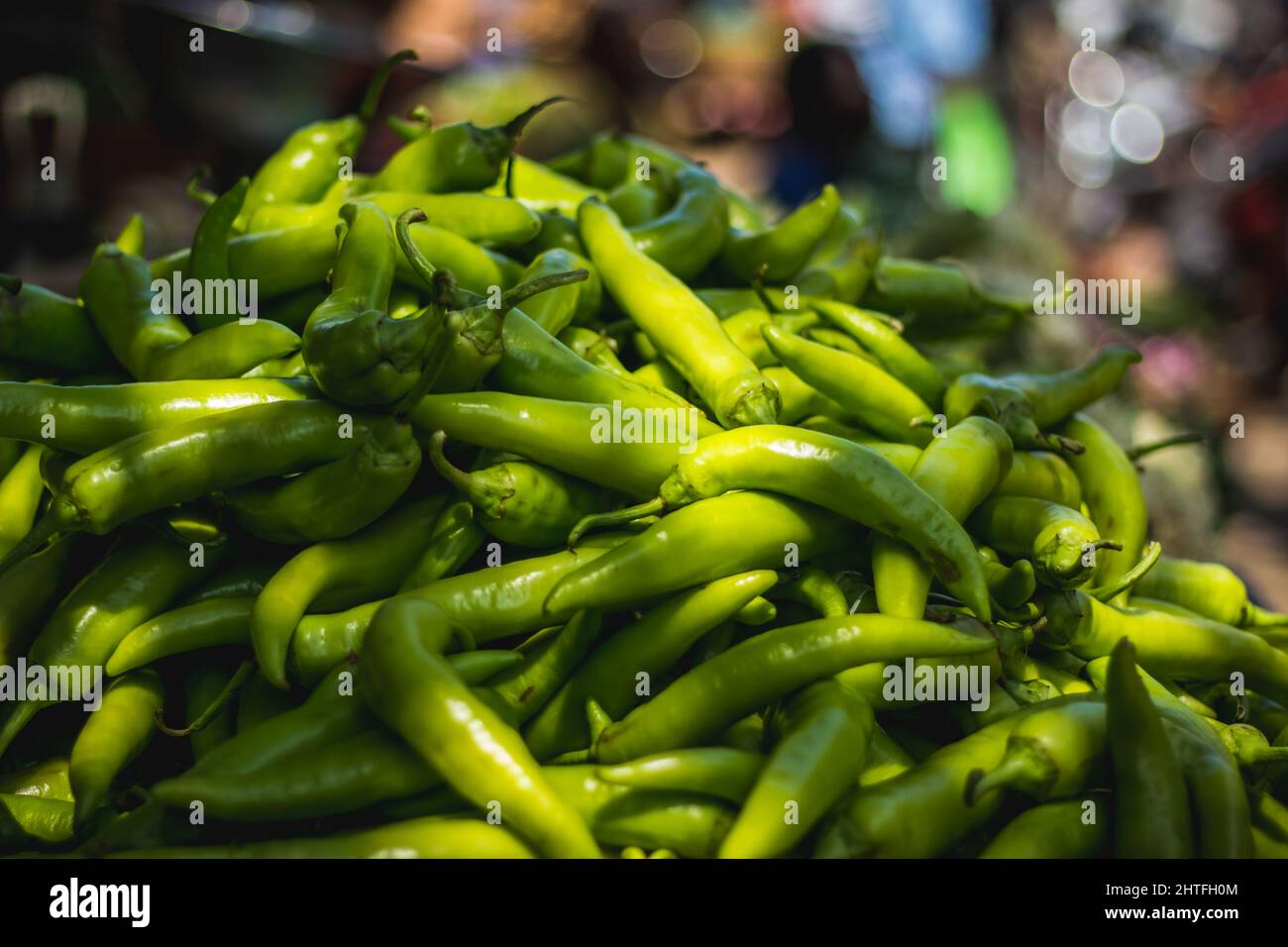 The green chili peppers for sale at a street market Stock Photo Alamy