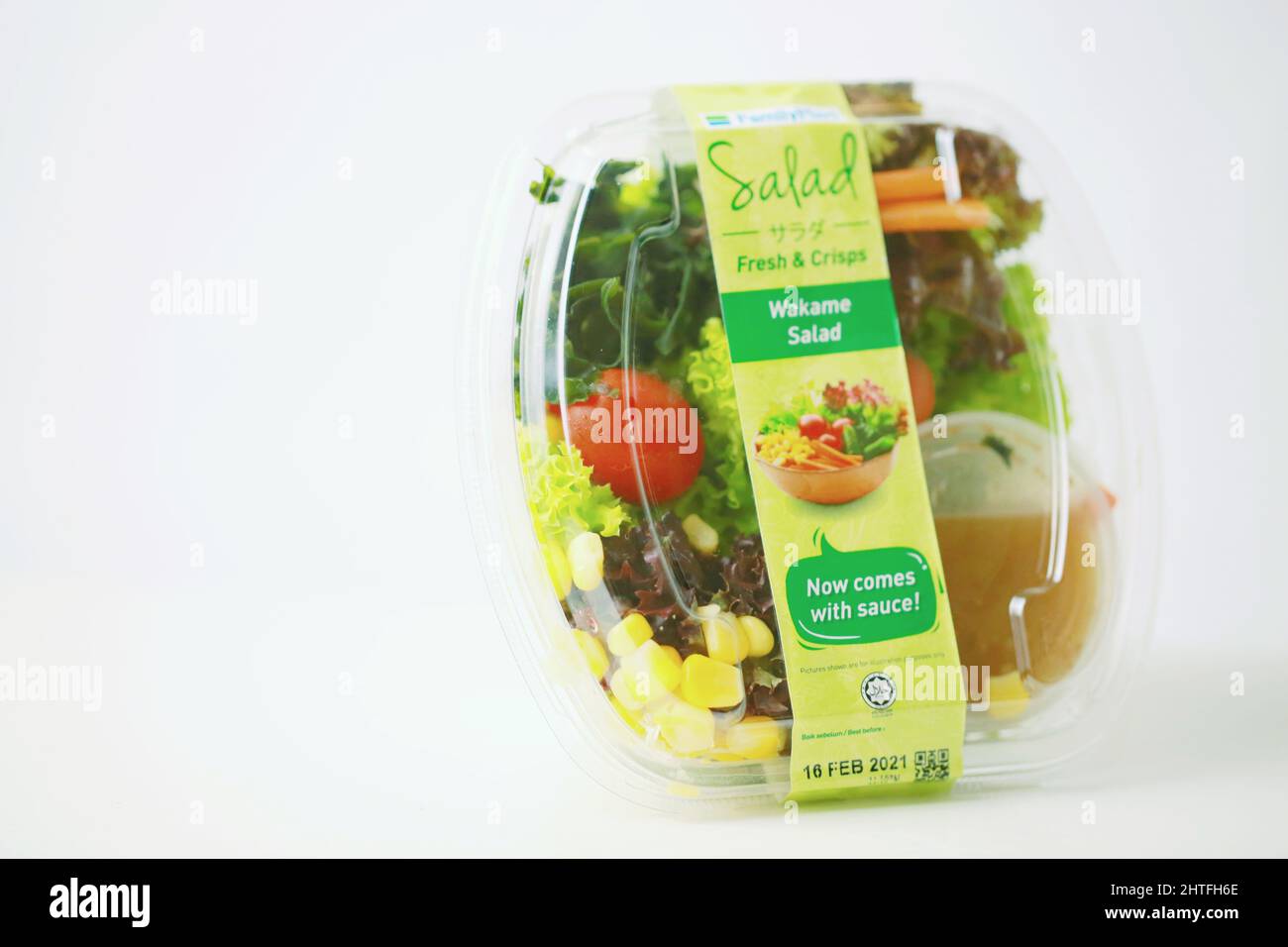 Closeup shot of the salad bowl from FamilyMart convenience store on the white background in Malacca Stock Photo