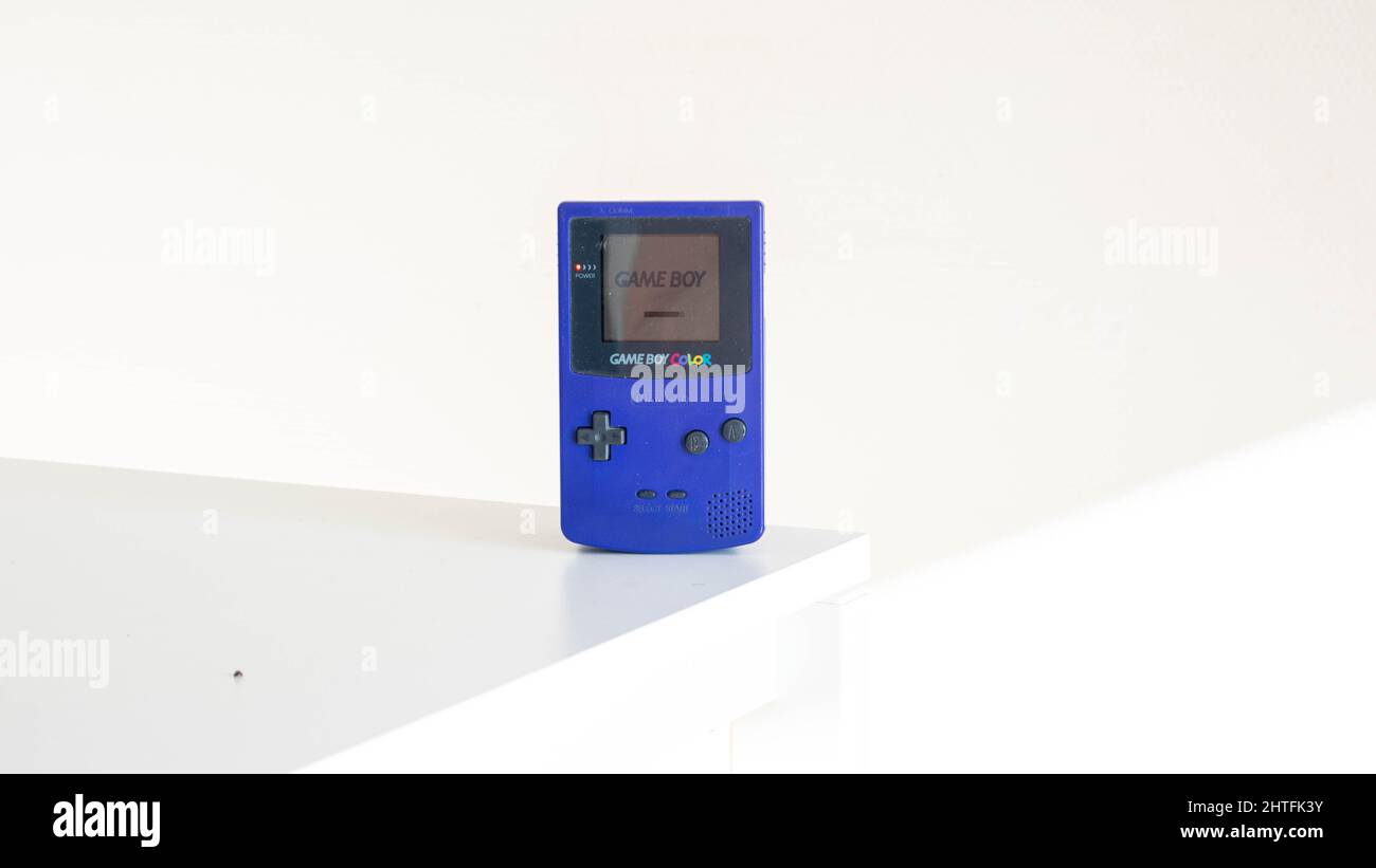 Gameboy color (Purple) on a white background with depth Stock Photo - Alamy