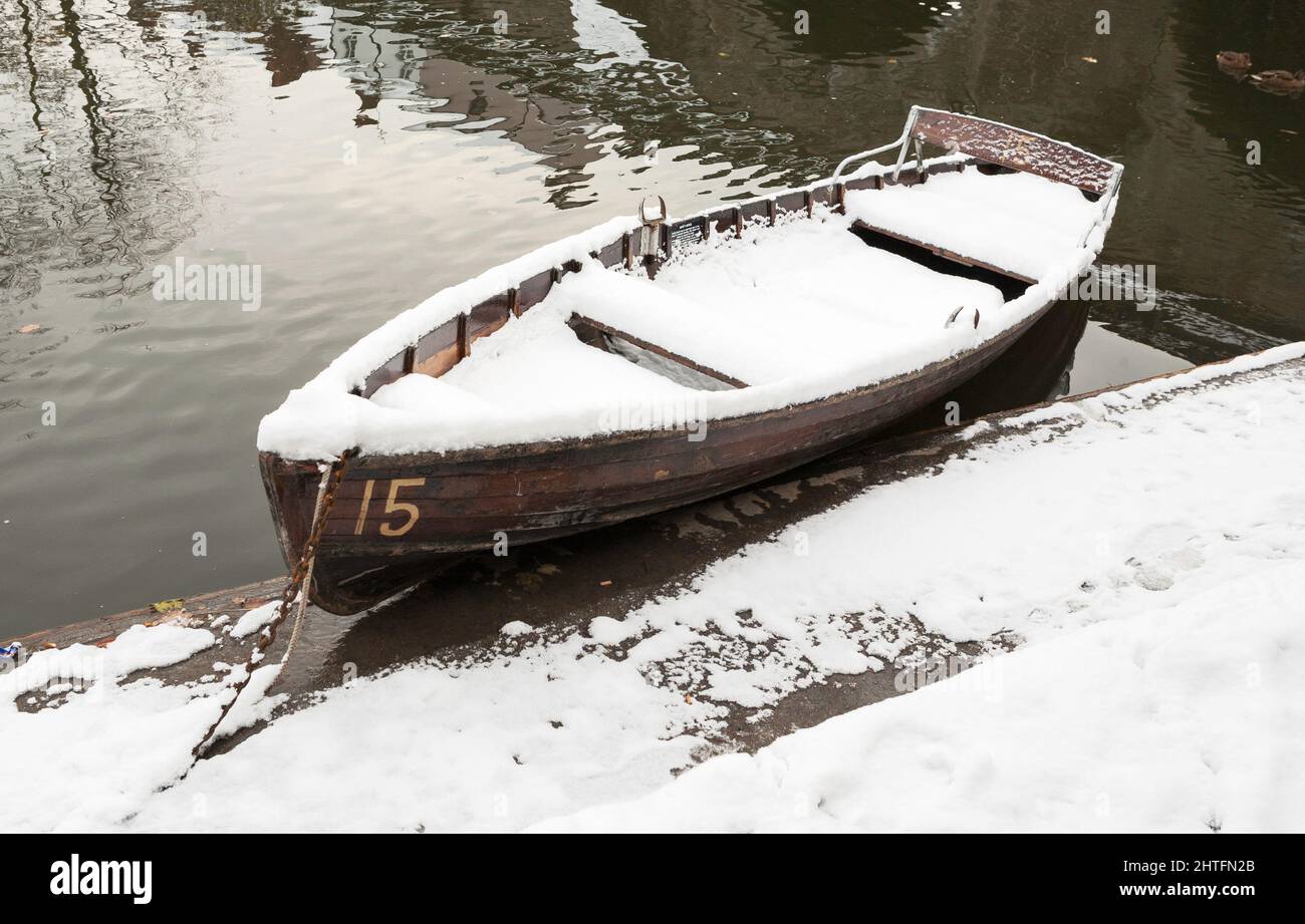 A rowing boat covered in snow, river Wear, city of Durham, England, UK Stock Photo