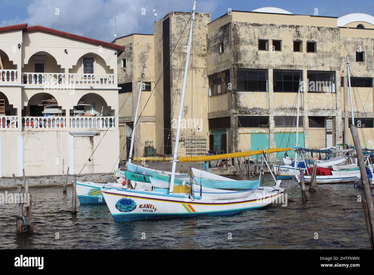 BELIZE CITY, BELIZE - JULY 6, 2016 the small fleet of fishing boats moored at the Swing Bridge with fishermen and boats from Sarteneja with the new ma Stock Photo