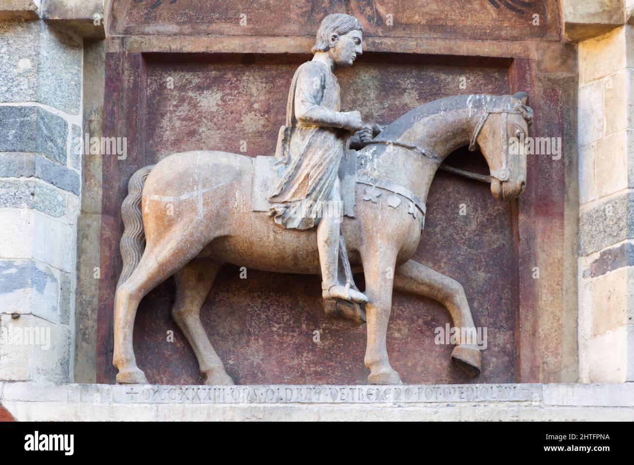 The relief representing Oldrado, a fierce prosecutor and butcher of the Cathar heretics - Palazzo della Ragione, Milan Stock Photo