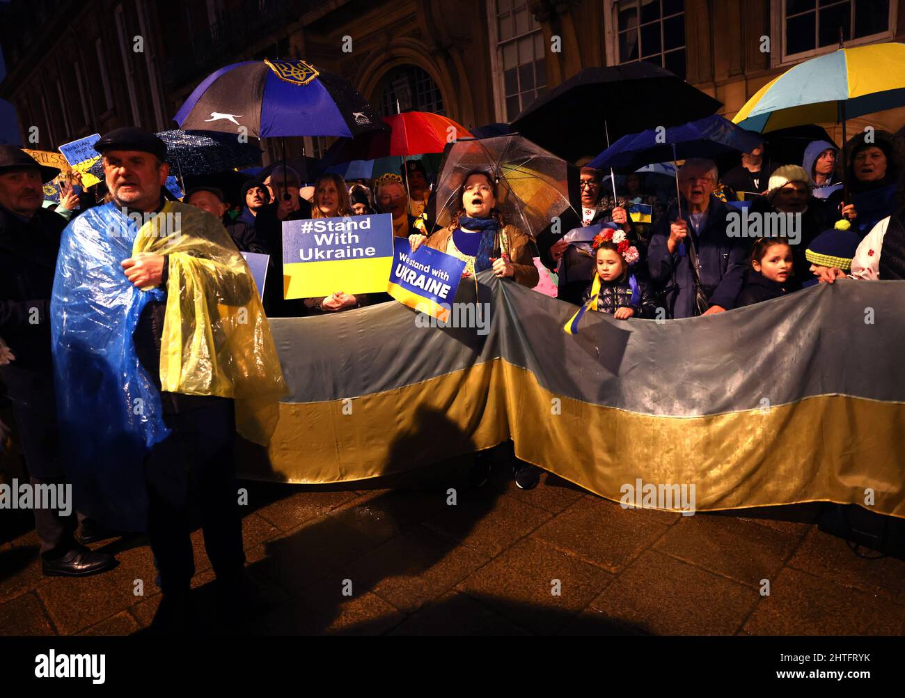 Leicester, Leicestershire, UK. 28th February 2022. Demonstrators attend a vigil after Russian President Vladimir Putin ordered the invasion of Ukraine. Hundreds of people gathered outside the Town Hall to show their support to Ukraine. Credit Darren Staples/Alamy Live News. Stock Photo
