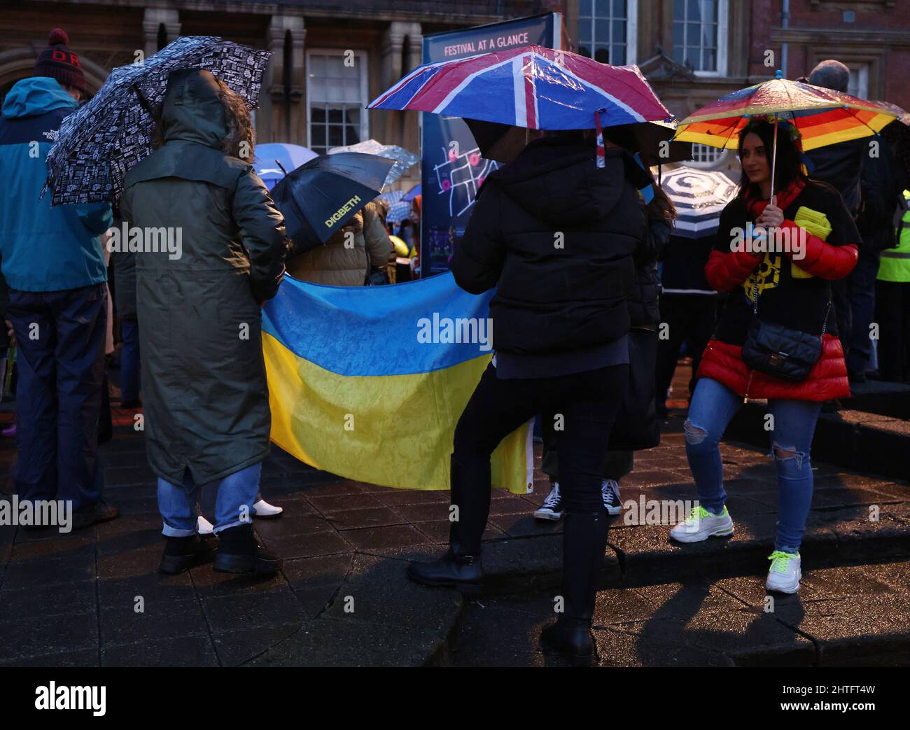 Leicester, Leicestershire, UK. 28th February 2022. Demonstrators attend a vigil after Russian President Vladimir Putin ordered the invasion of Ukraine. Hundreds of people gathered outside the Town Hall to show their support to Ukraine. Credit Darren Staples/Alamy Live News. Stock Photo