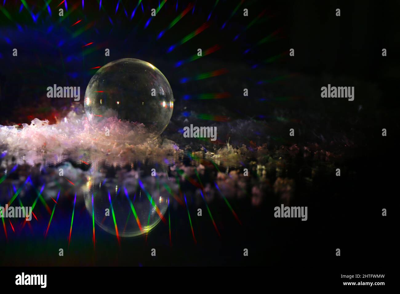 a selective shot of crystal refracting light with colored lights on a a selective shot of crystal refracting light with colored lights on a