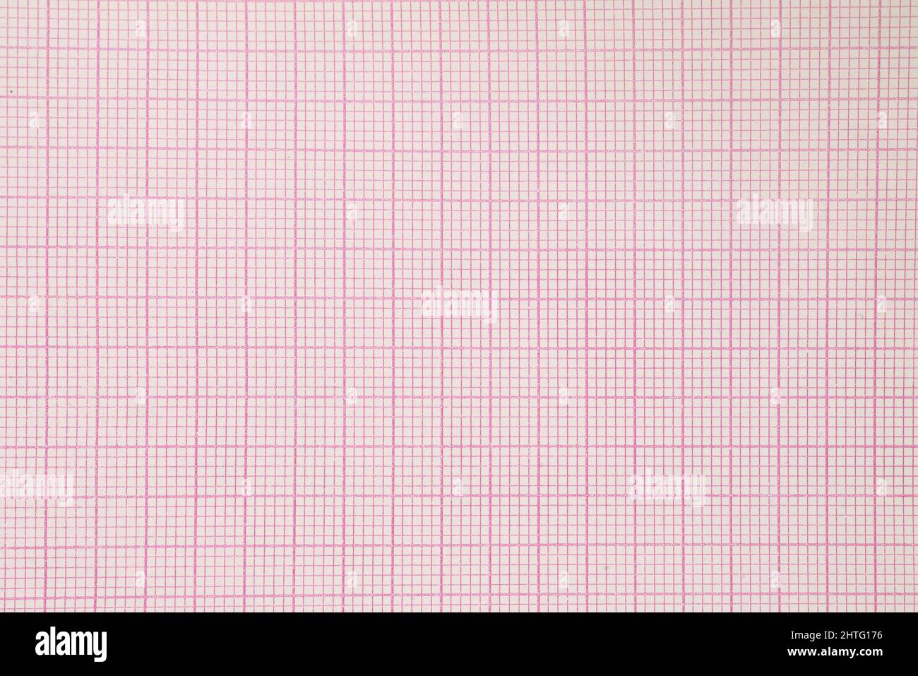 Pink graph paper close up. Top view for texture and background Stock Photo