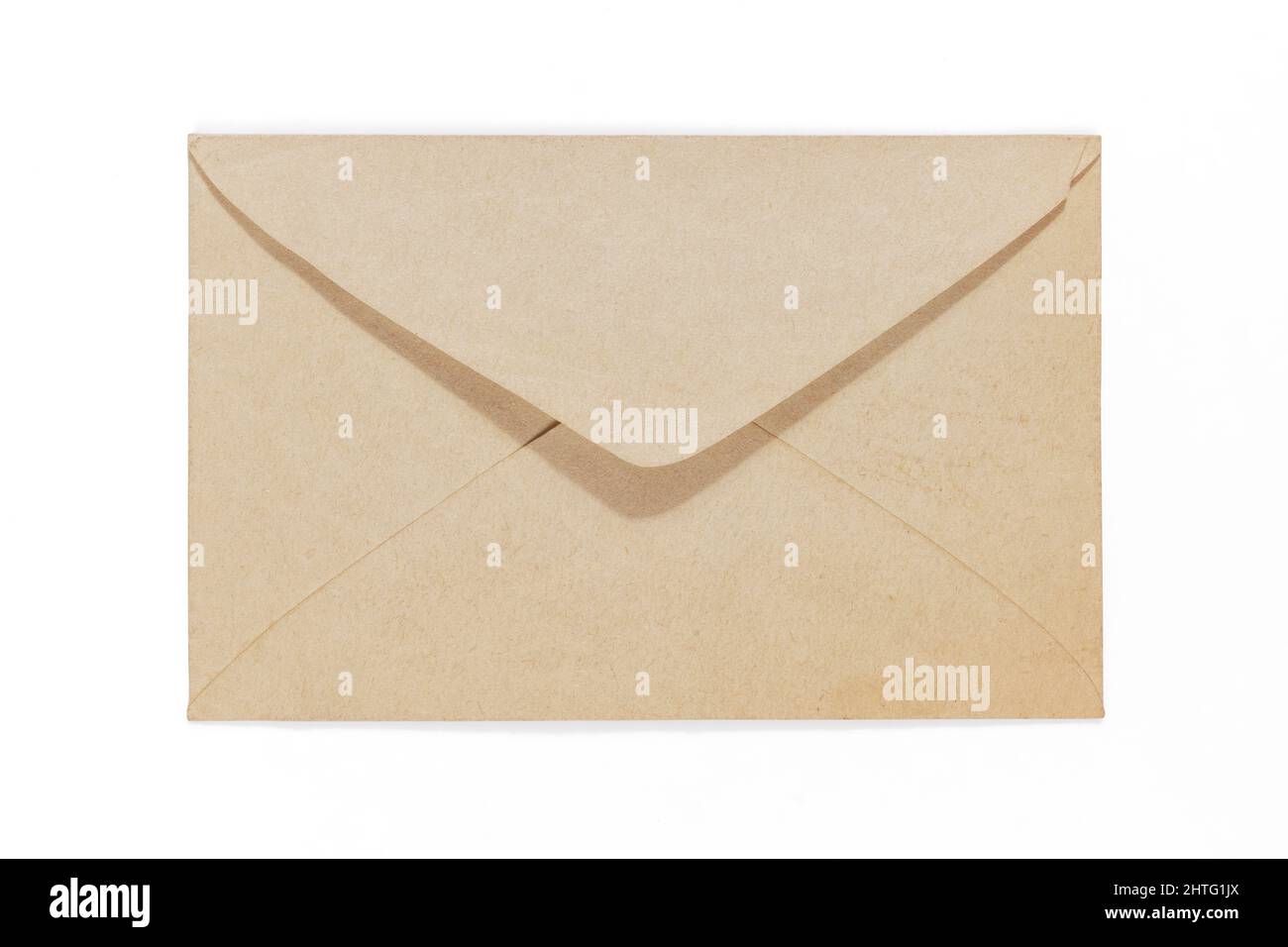 Old yellow aged envelope with copy space on it. Isolated on white