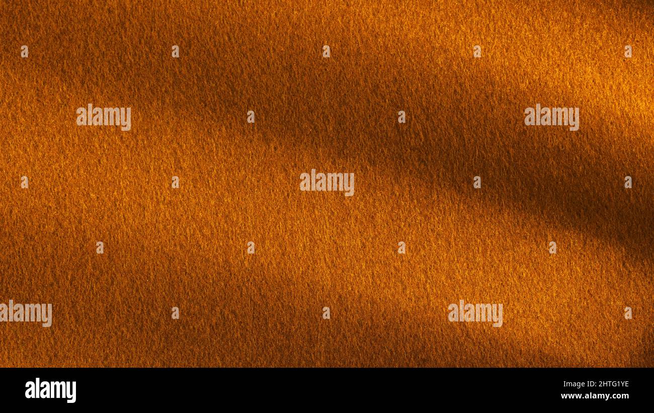 Bronze colored felt table surface with deep shadows. Large macro texture and background Stock Photo