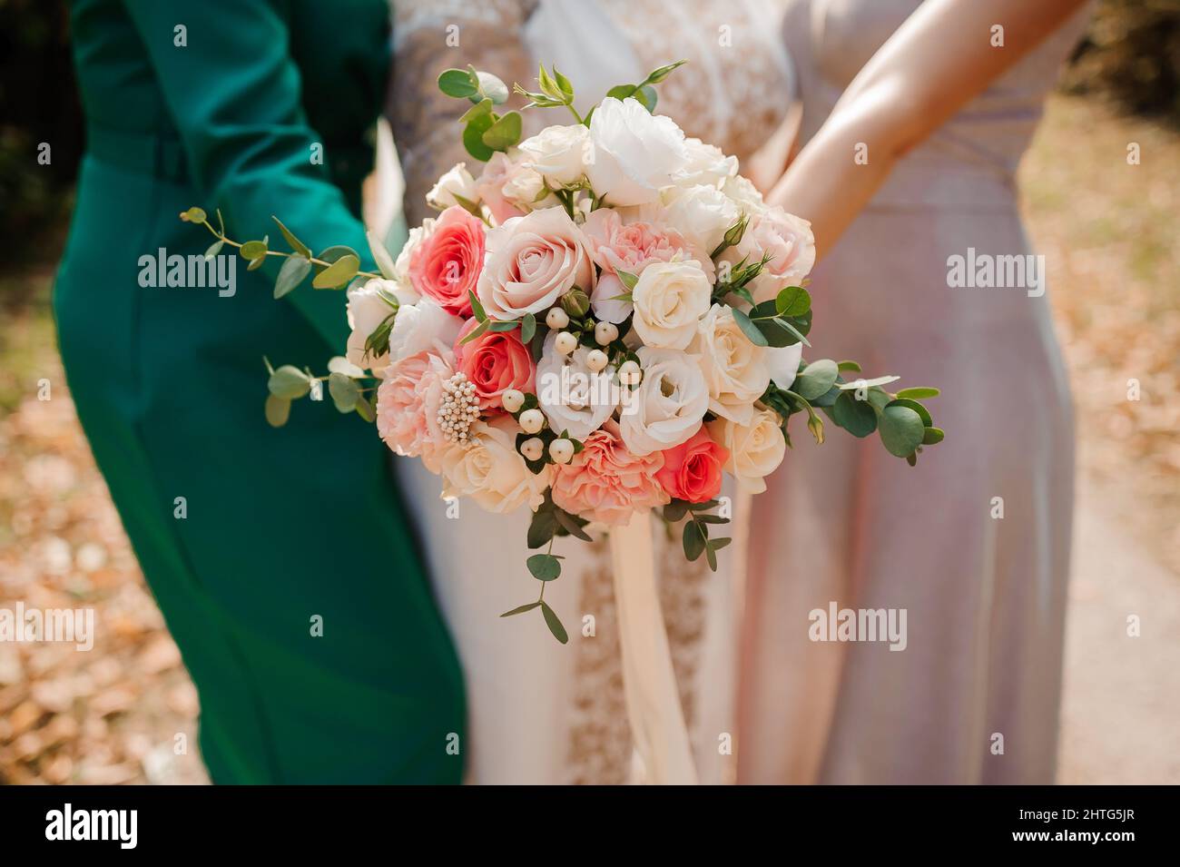 Wedding bouquet in the hands of the bride. Bridal bouquet Stock Photo