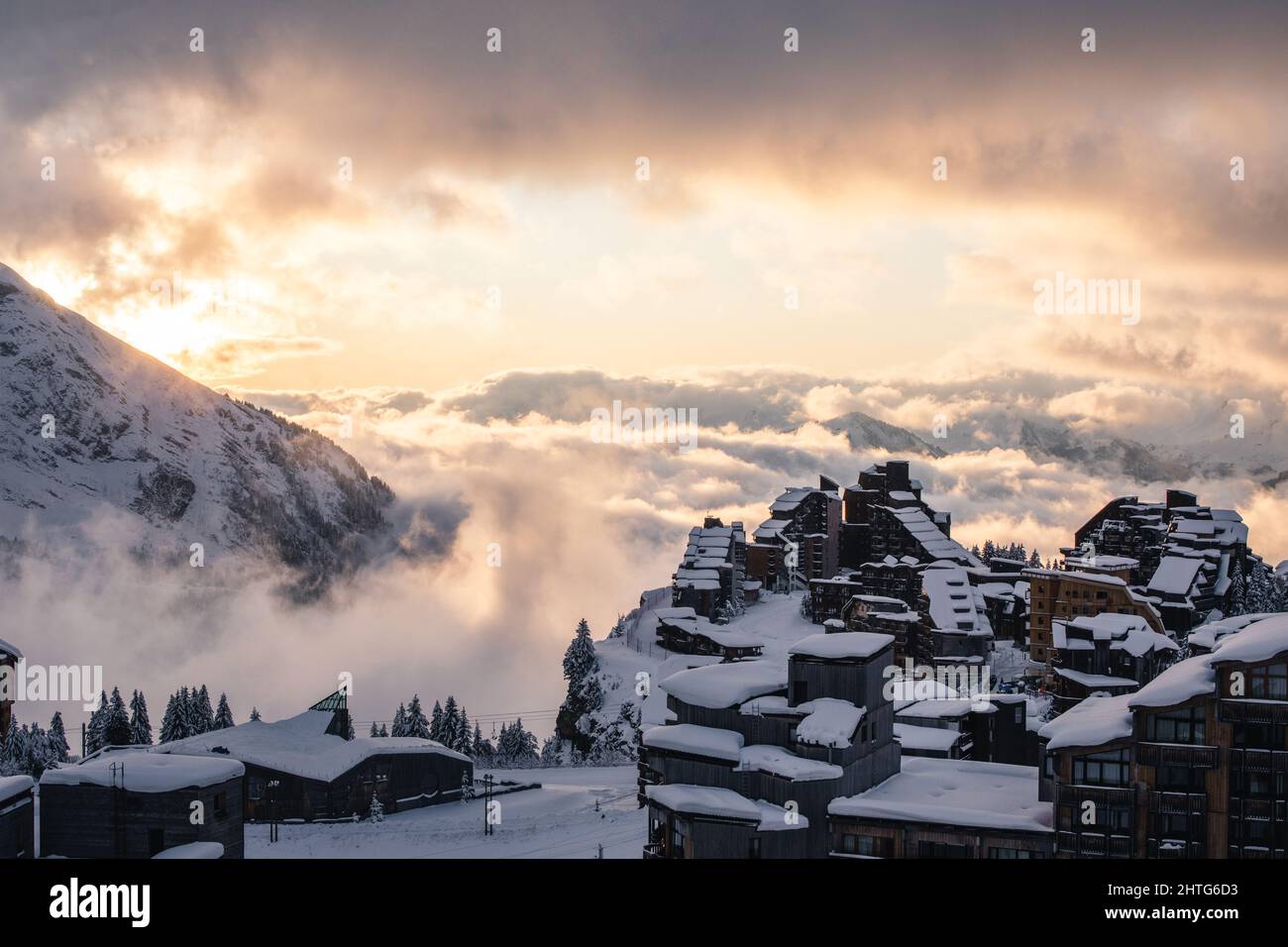 Sunset at the ski resort with cloudy sky on the background Stock Photo ...