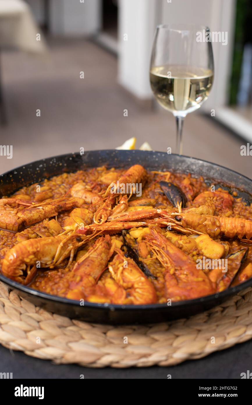 seafood paella with wine Stock Photo Alamy