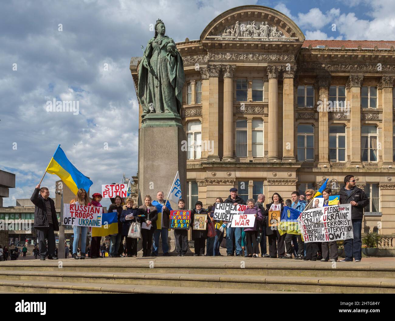 Demonstrators carrying the Ukrainian flag meet in Birmingham city centre to protest the invasion and annexation of Crimea by the Russian Federation. Stock Photo